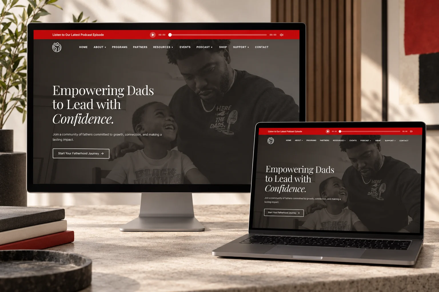 Here For The Dads website presented on a desktop monitor and laptop in a branded studio mockup
