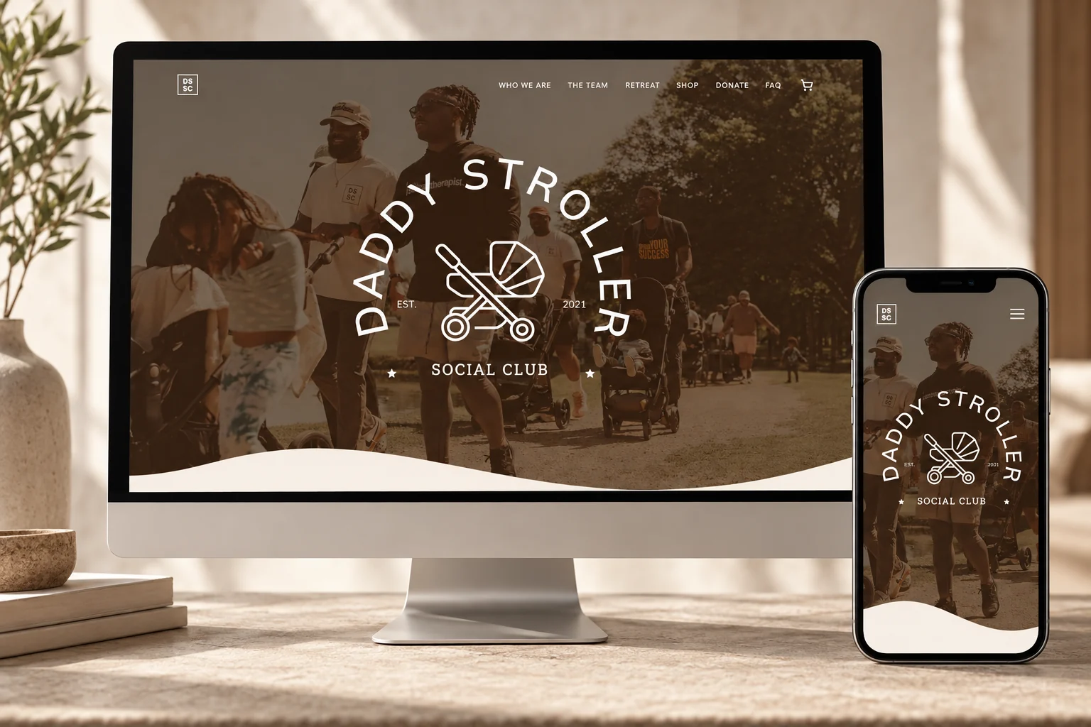 Daddy Stroller Social Club website presented on a desktop monitor and phone