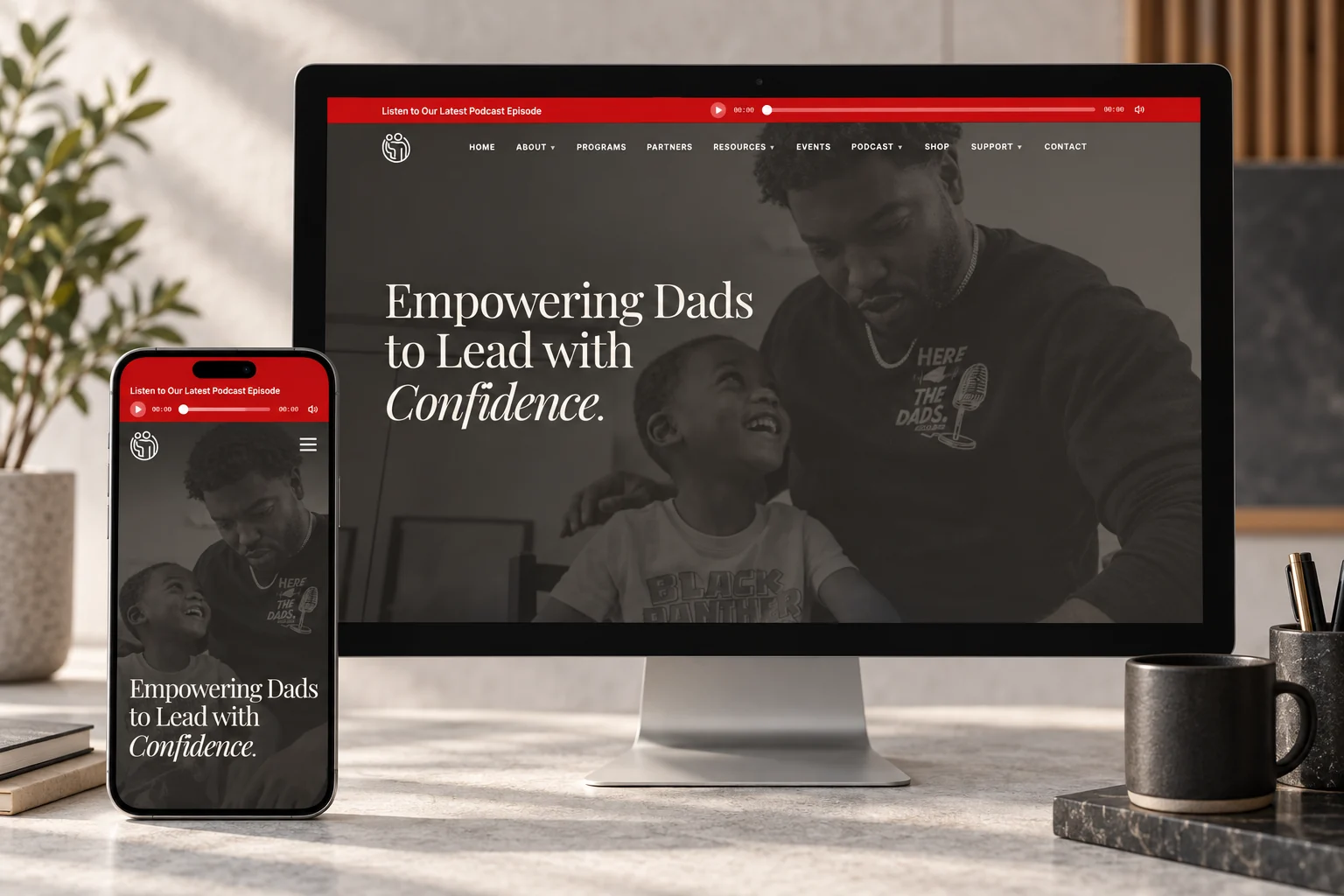 Here For The Dads website presented on a desktop monitor and phone